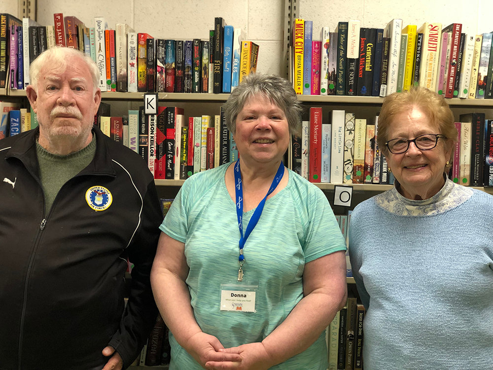Friends of the Newburgh Library [L-R] Bob Browning, Donna Rickey and President Suzanne Dawes prepare books for the upcoming Reading Day and thank all for donating and supporting the library.